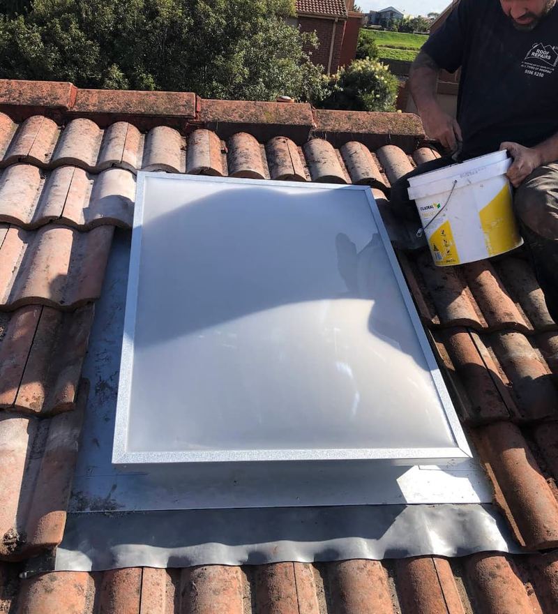 Skylight repair on terracotta tile roof