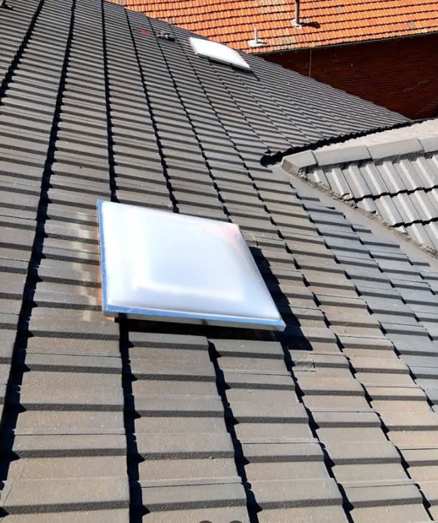 Skylight on dark tile roof bayside Melbourne