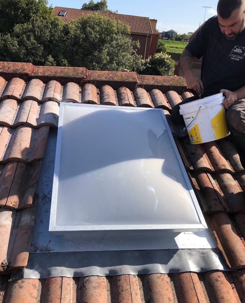 Skylight installation in progress on terracotta tiles