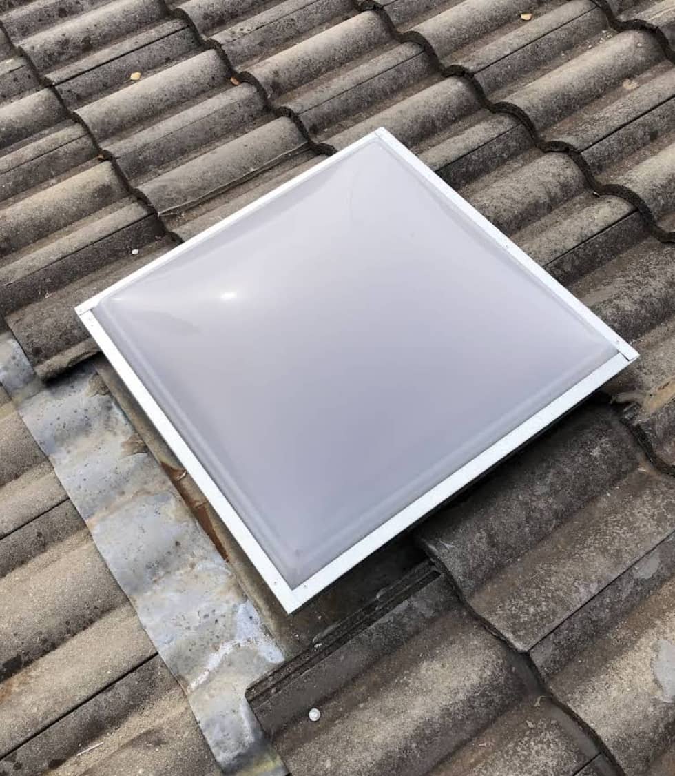 New skylight dome on concrete tile roof